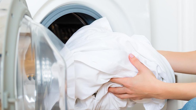 putting sheets in dryer